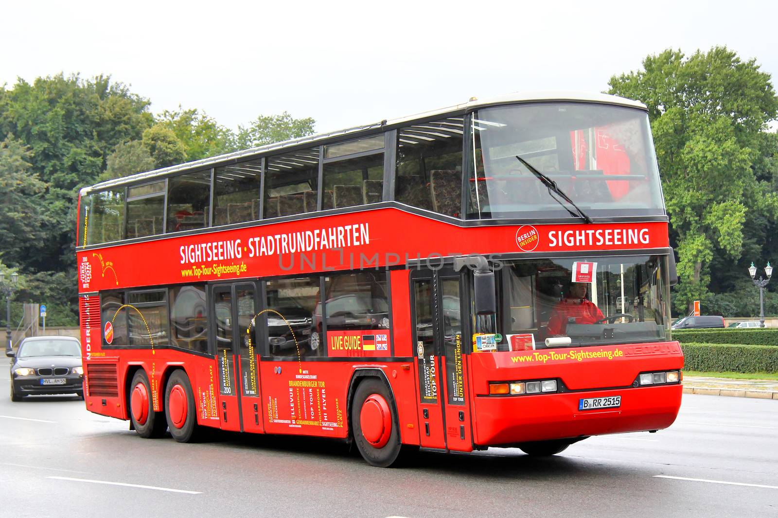 BERLIN, GERMANY - SEPTEMBER 10, 2013: Red Neoplan N4026/3 sightseeing bus at the city street.