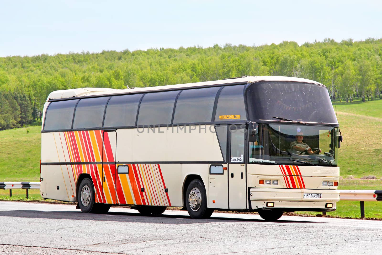 BASHKORTOSTAN, RUSSIA - MAY 20, 2013: Neoplan N116 Cityliner interurban coach at the interurban road.