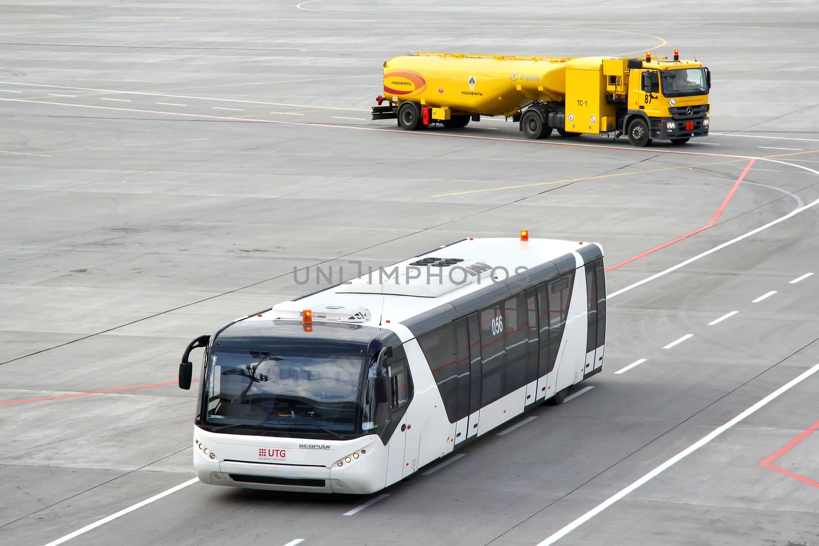 MOSCOW, RUSSIA - SEPTEMBER 9, 2013: White Neoplan N9122 airport bus at the Vnukovo international airport.