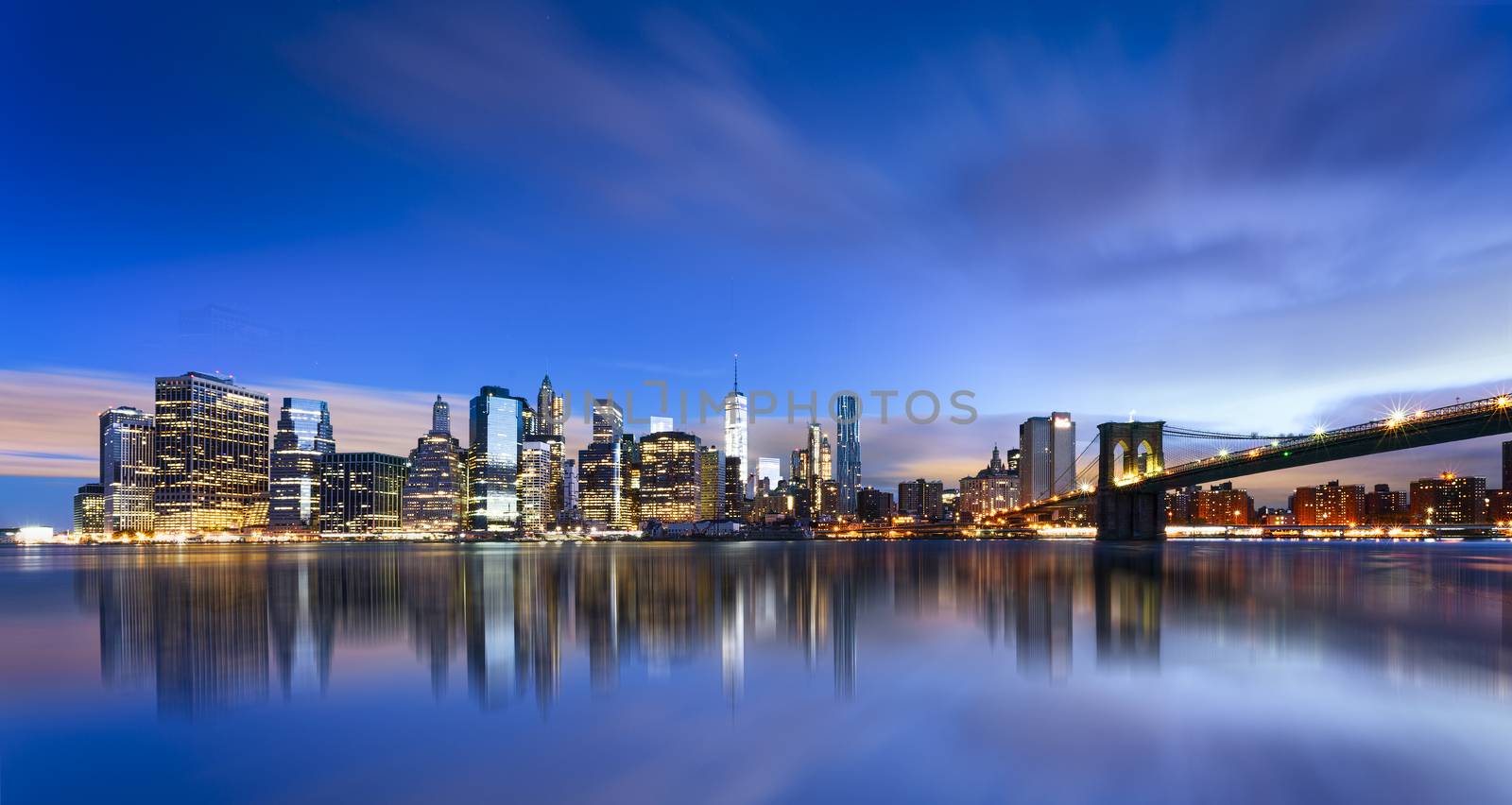 New York City - beautiful sunrise over manhattan with manhattan and brooklyn bridge USA