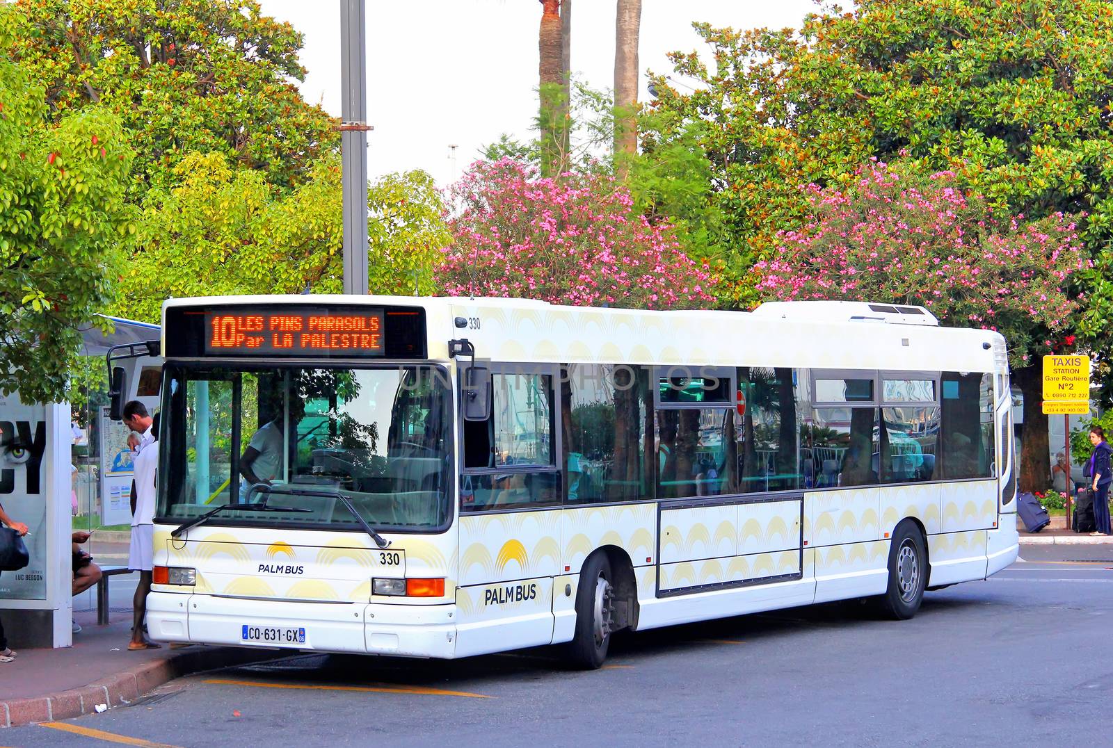 CANNES, FRANCE - AUGUST 3, 2014: White urban bus Heuliez GX317 at the bus station.