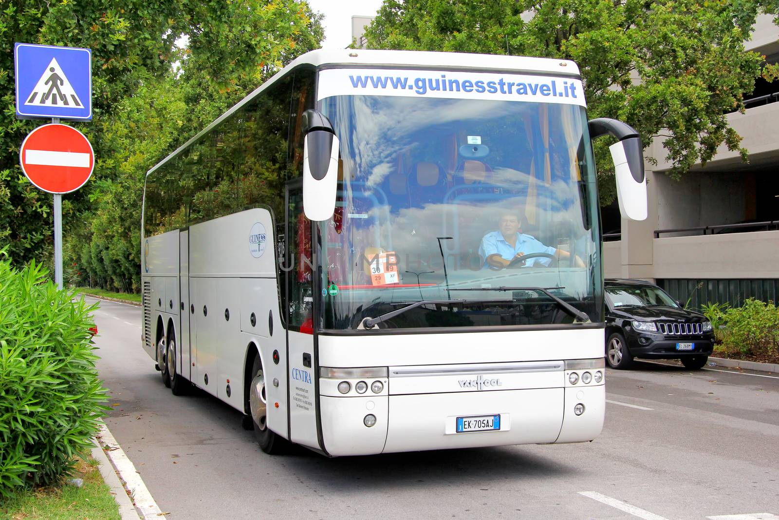 VENICE, ITALY - JULY 30, 2014: Touristic coach Van Hool T916 Astron at the city street.