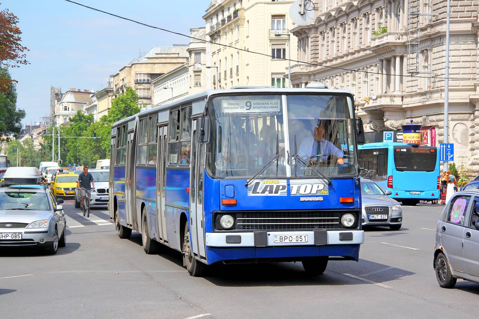 BUDAPEST, HUNGARY - JULY 23, 2014: Blue articulated city bus Ikarus 280.49 at the city street.