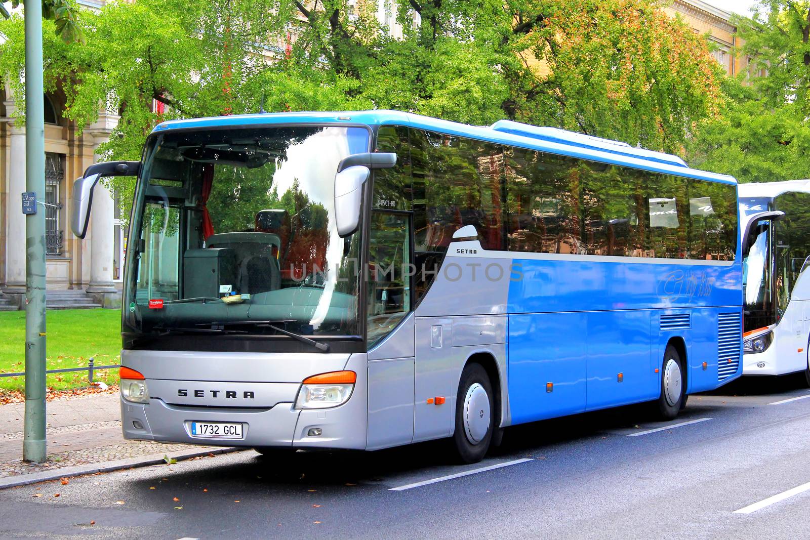 BERLIN, GERMANY - AUGUST 16, 2014: Grey and blue interurban coach Setra S415GT-HD at the city street.