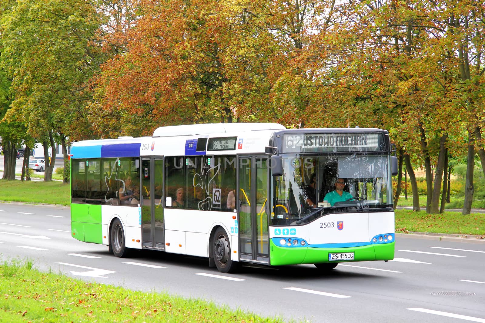 SZCZECIN, POLAND - AUGUST 13, 2014: White and green city bus Solaris Urbino 12 at the city street.