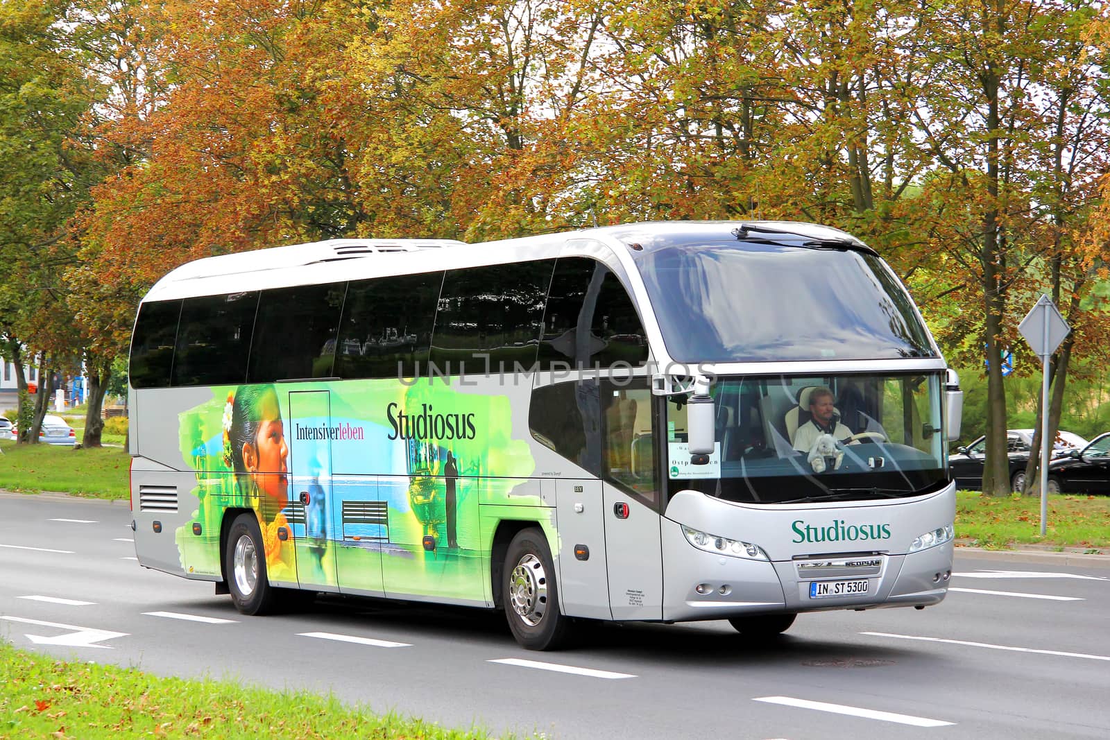SZCZECIN, POLAND - AUGUST 13, 2014: Modern interurban coach Neoplan N1216HD at the city street.