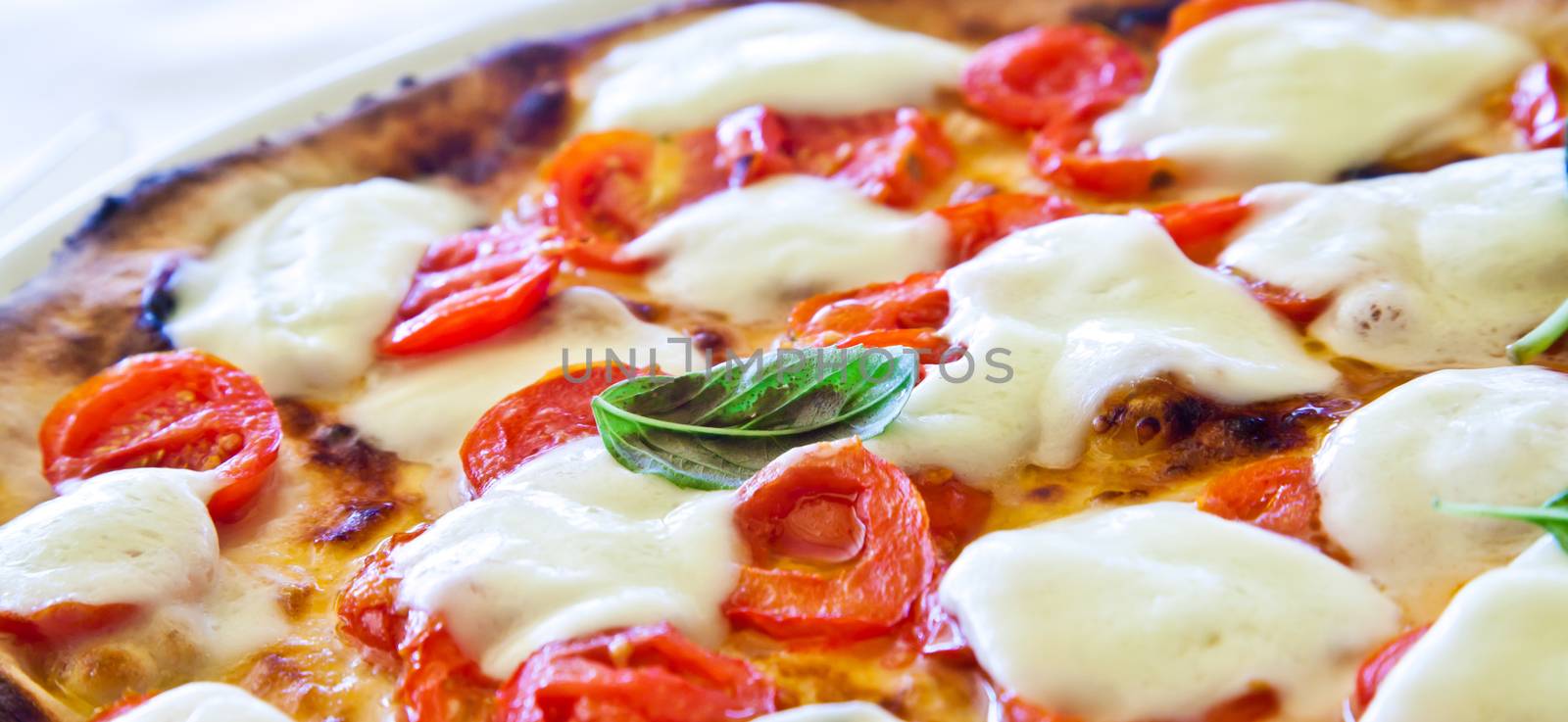 This is a true Italian Pizza. Traditional Pizza Margherita served in a Capri's restaurant, Naples Gulf, Italy.