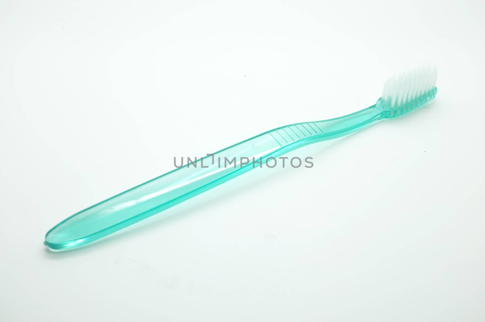 Toothbrush on white background by Hepjam