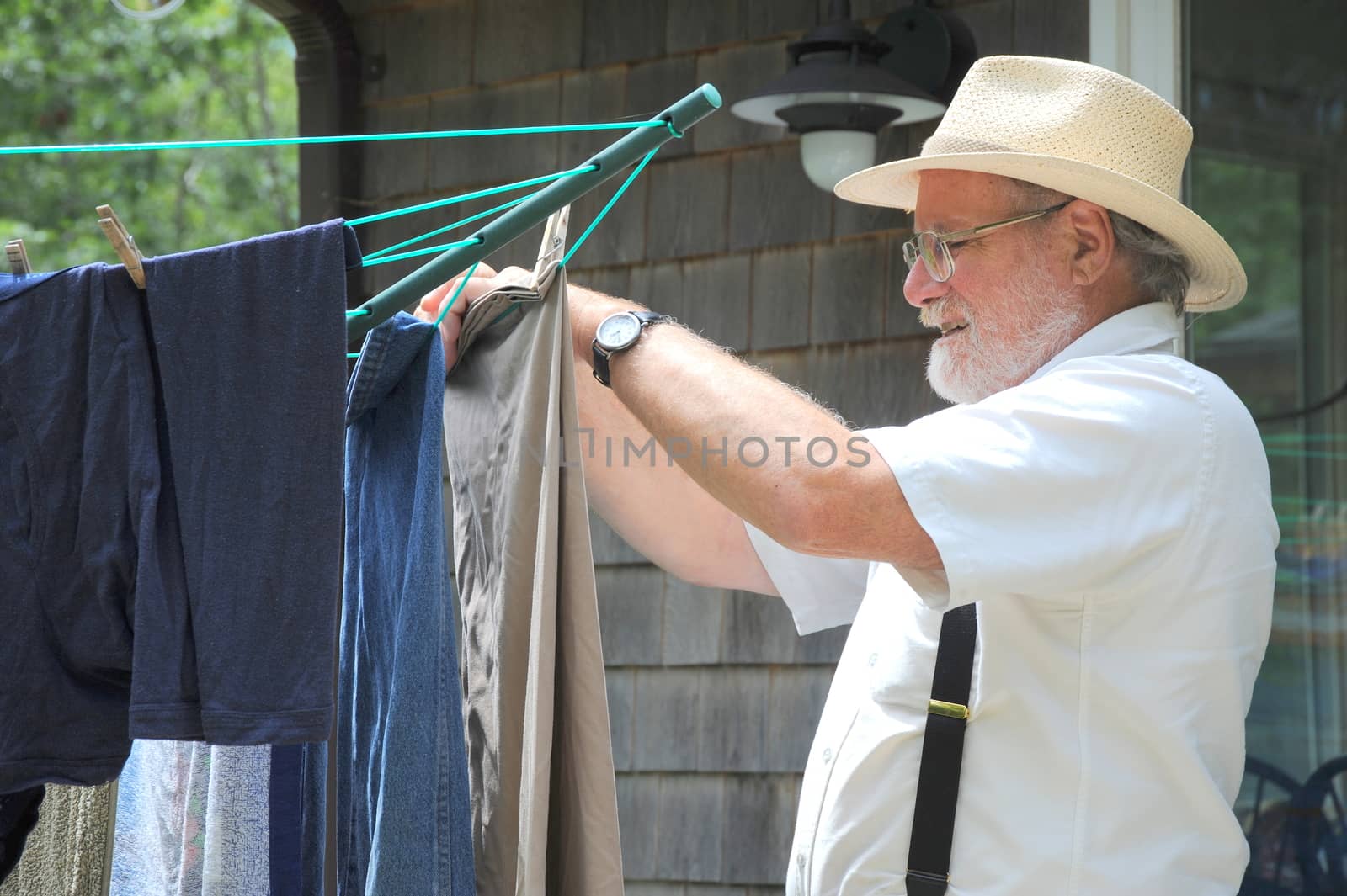 Country gentleman doing his laundry outside.