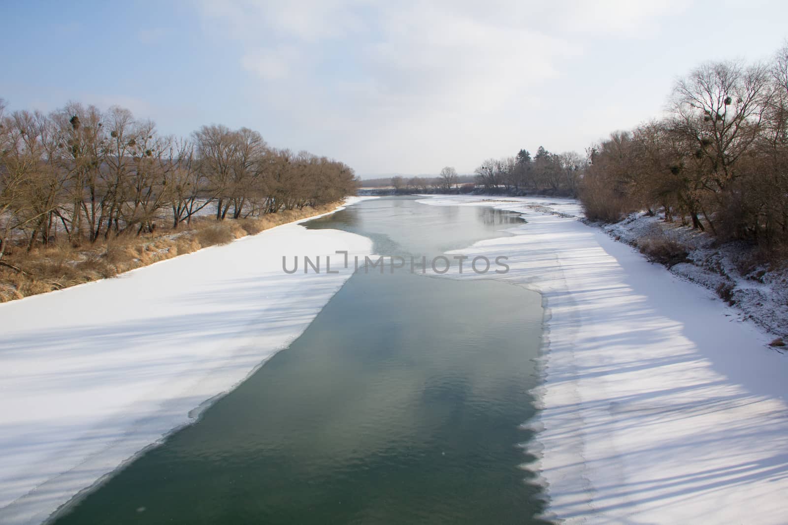 Winter river and trees landscape in Ukraine