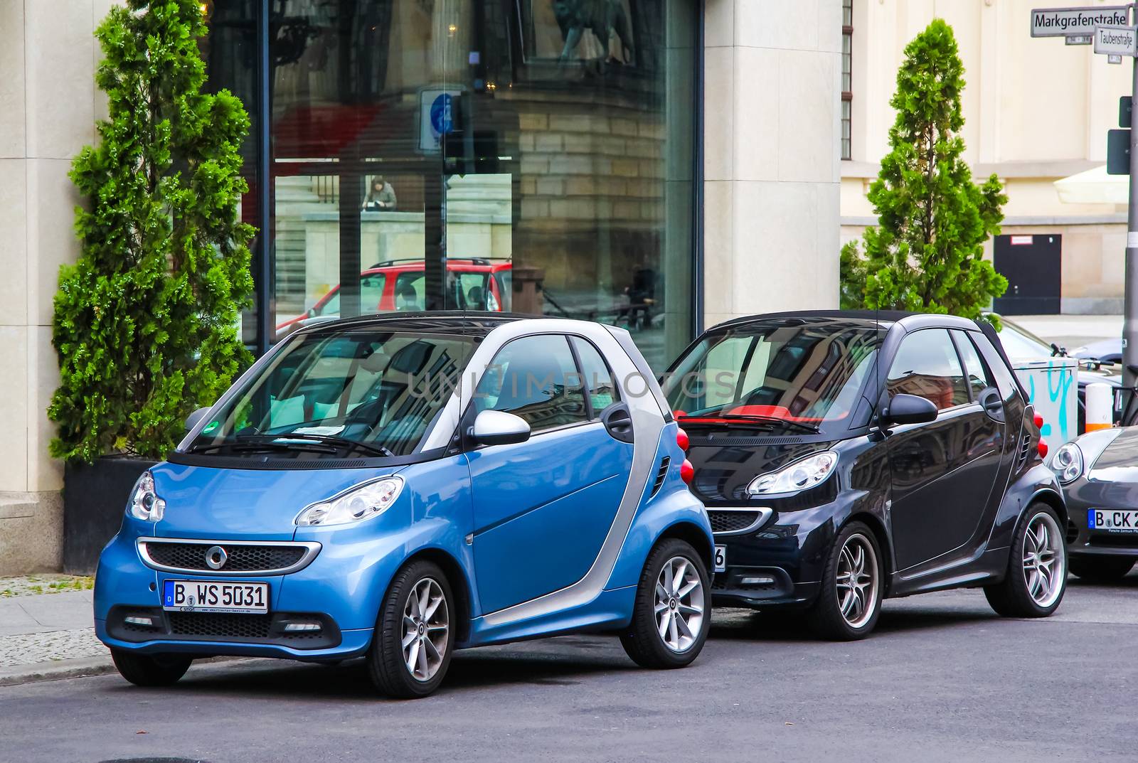 BERLIN, GERMANY - SEPTEMBER 12, 2013: Motor cars Smart Fortwo at the city street.