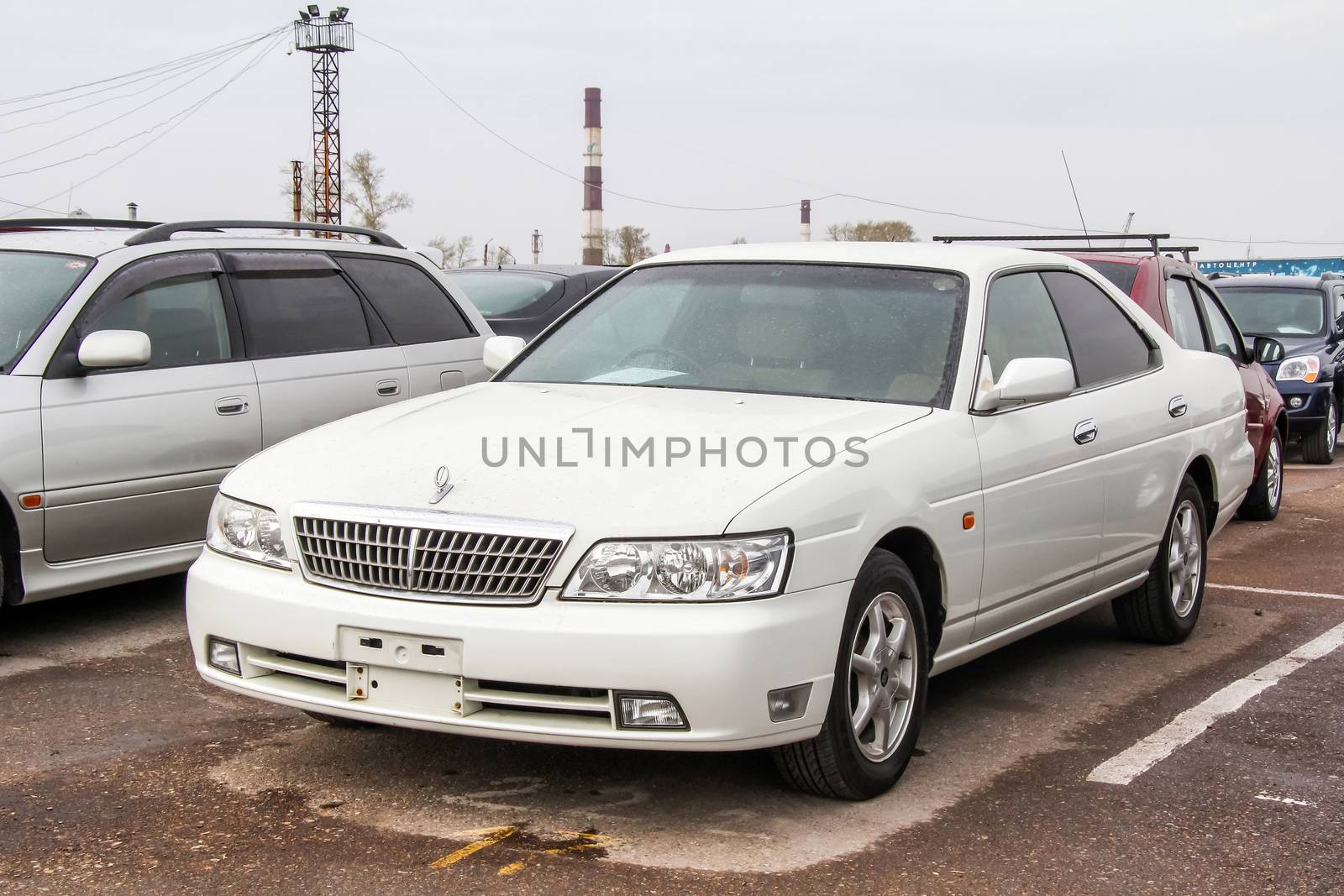 UFA, RUSSIA - APRIL 19, 2012: Motor car Nissan Laurel at the used cars trade center.