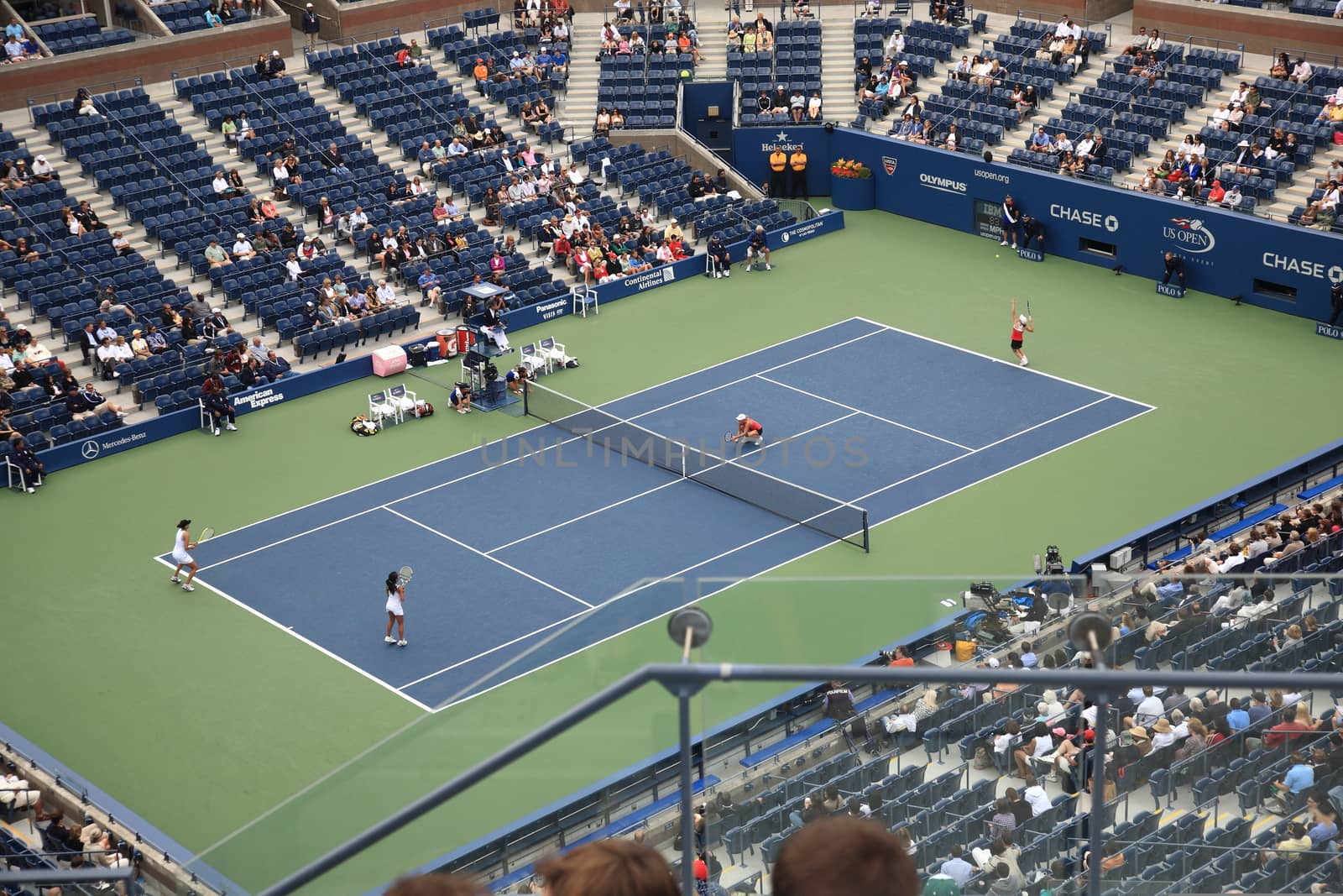 Fans and players at center court in Arthur Ashe Stadium for a U.S. Open day session tennis match.