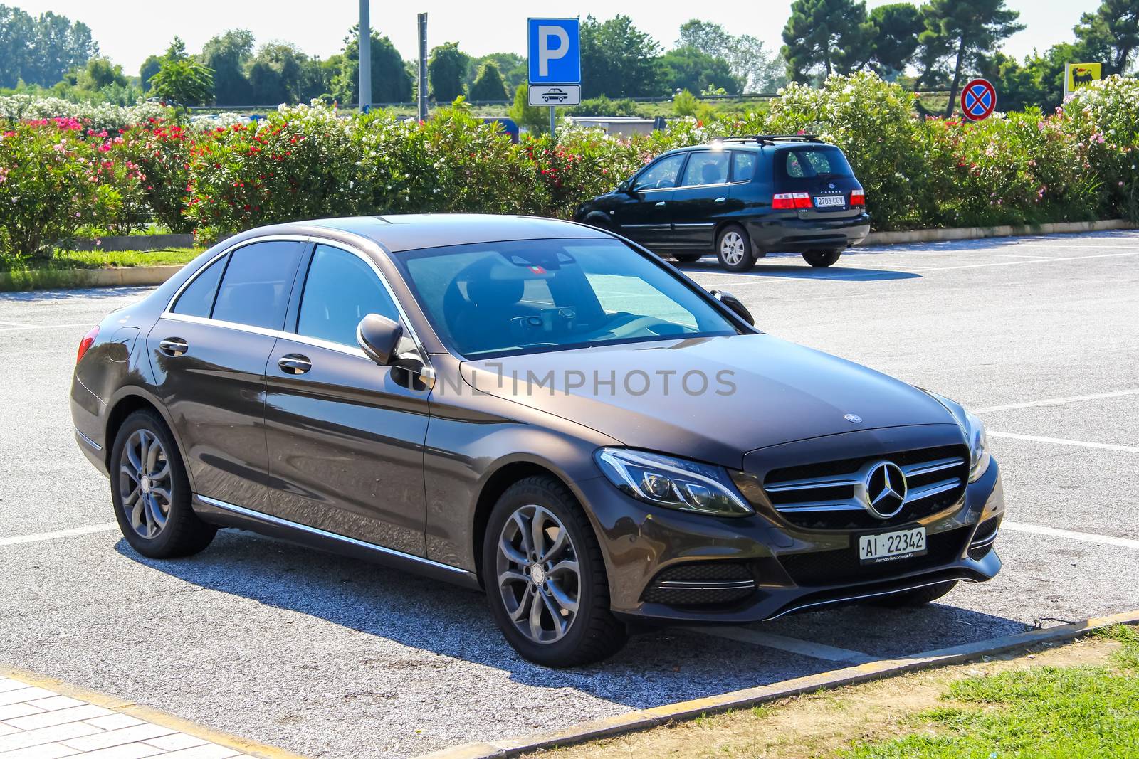 TUSCANY, ITALY - AUGUST 1, 2014: Motor car Mercedes-Benz W205 C-class at the interurban road.