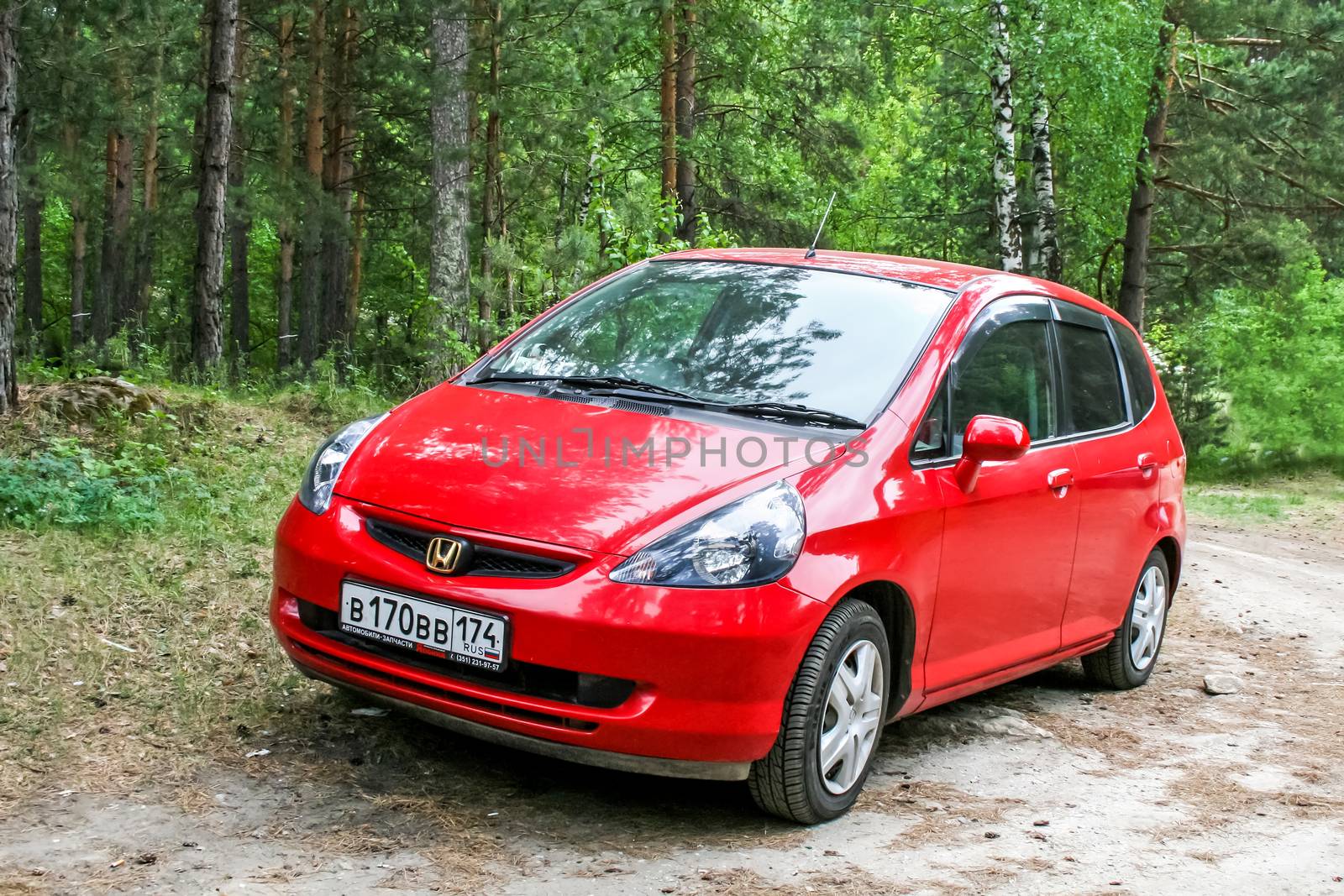 MIASS, RUSSIA - JUNE 12, 2009: Motor car Honda Fit in the forest.
