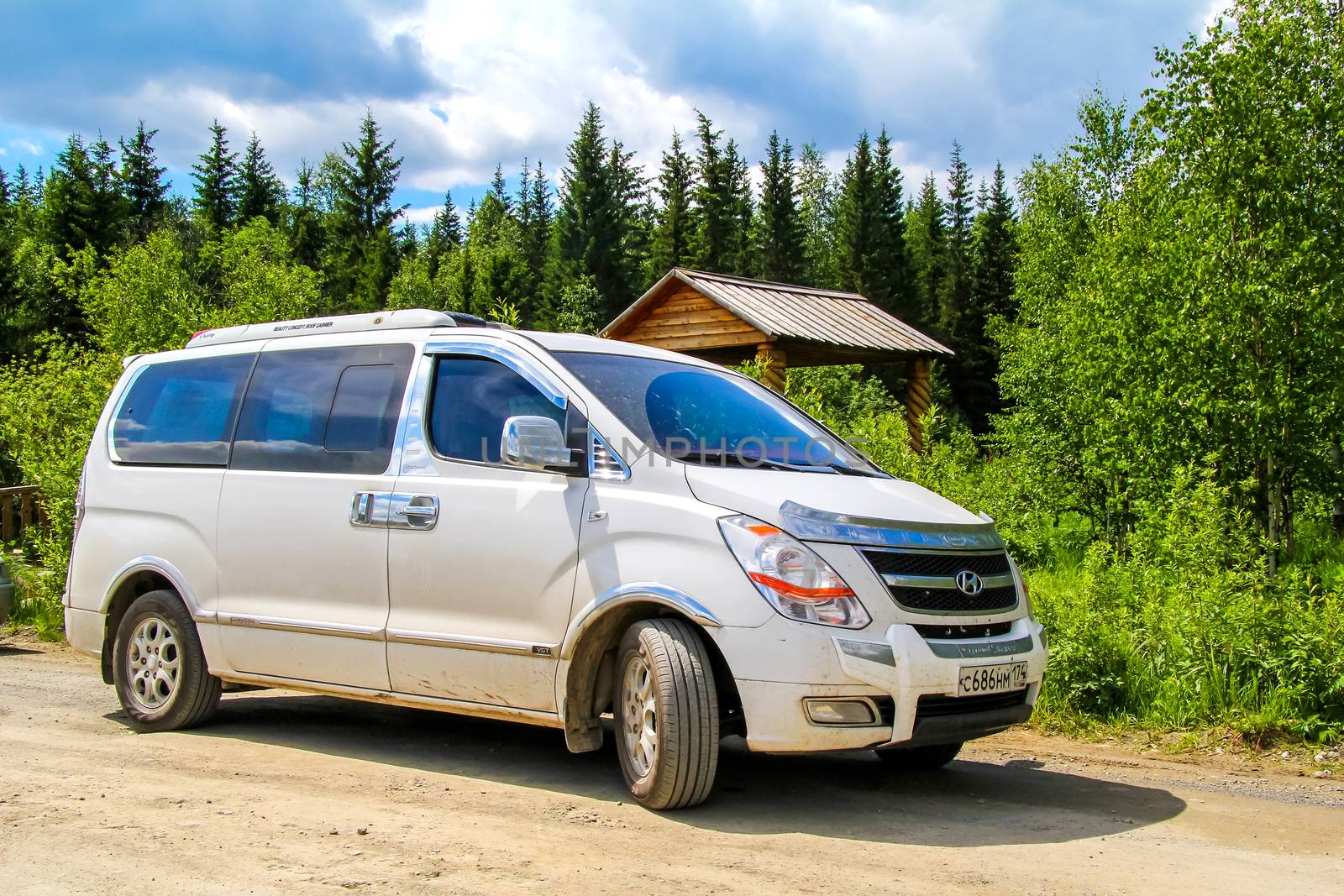 CHELYABINSK REGION, RUSSIA - JUNE 12, 2012: Motor car Hyundai H1 at the countryside.