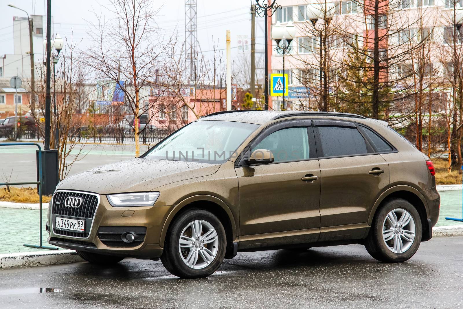 NOVYY URENGOY, RUSSIA - JUNE 2, 2014: Motor car Audi Q3 at the city street.