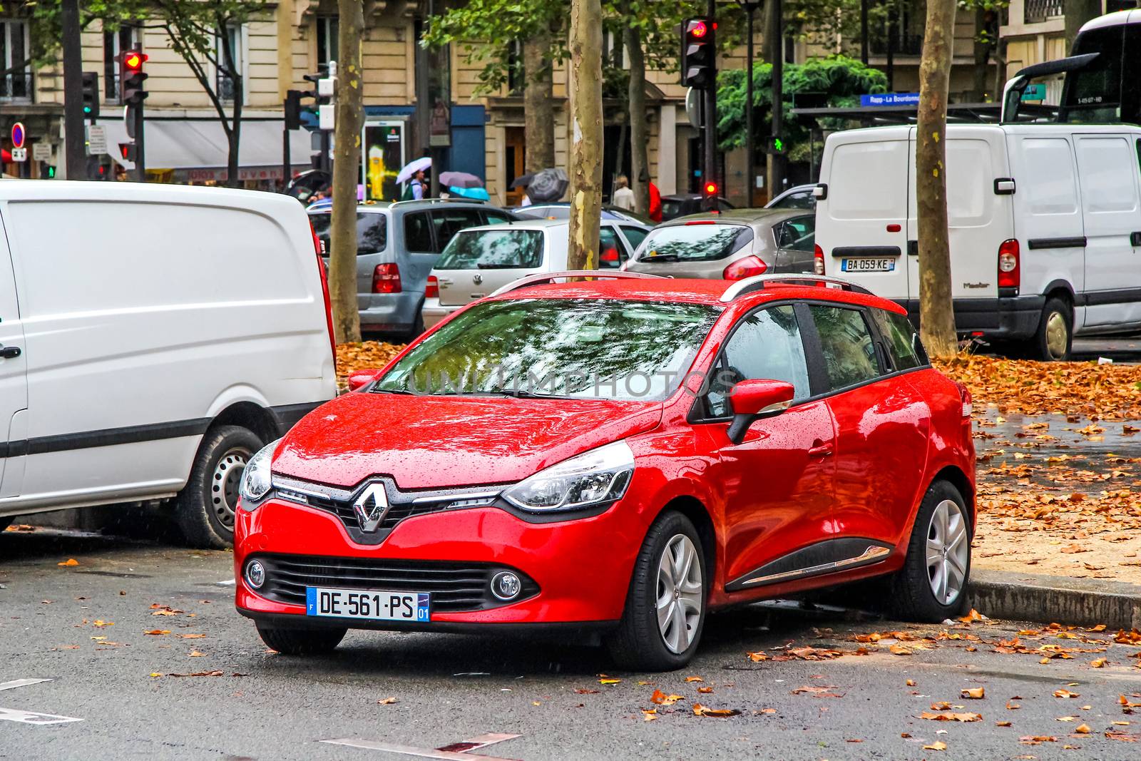 PARIS, FRANCE - AUGUST 8, 2014: Motor car Renault Clio at the city street.