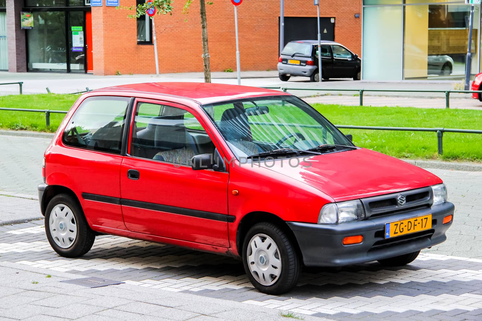 ROTTERDAM, NETHERLANDS - AUGUST 9, 2014: Motor car Suzuki at the city street.