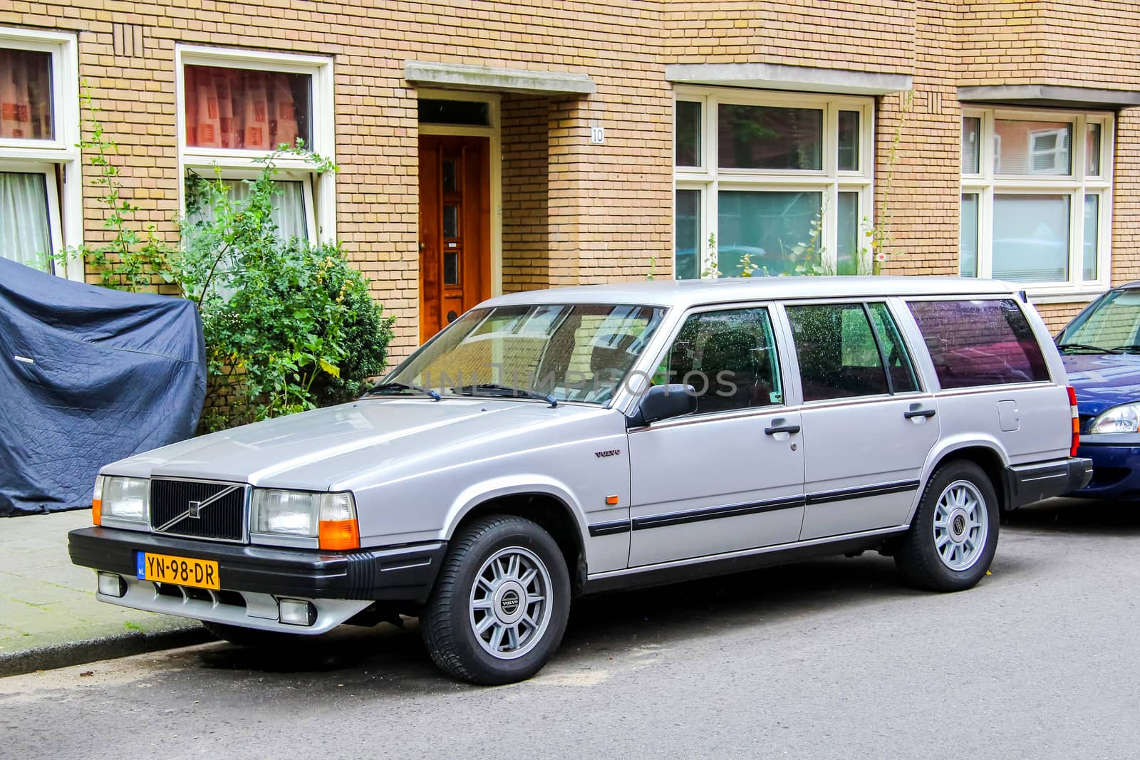 AMSTERDAM, NETHERLANDS - AUGUST 10, 2014: Motor car Volvo 700 Series at the city street.