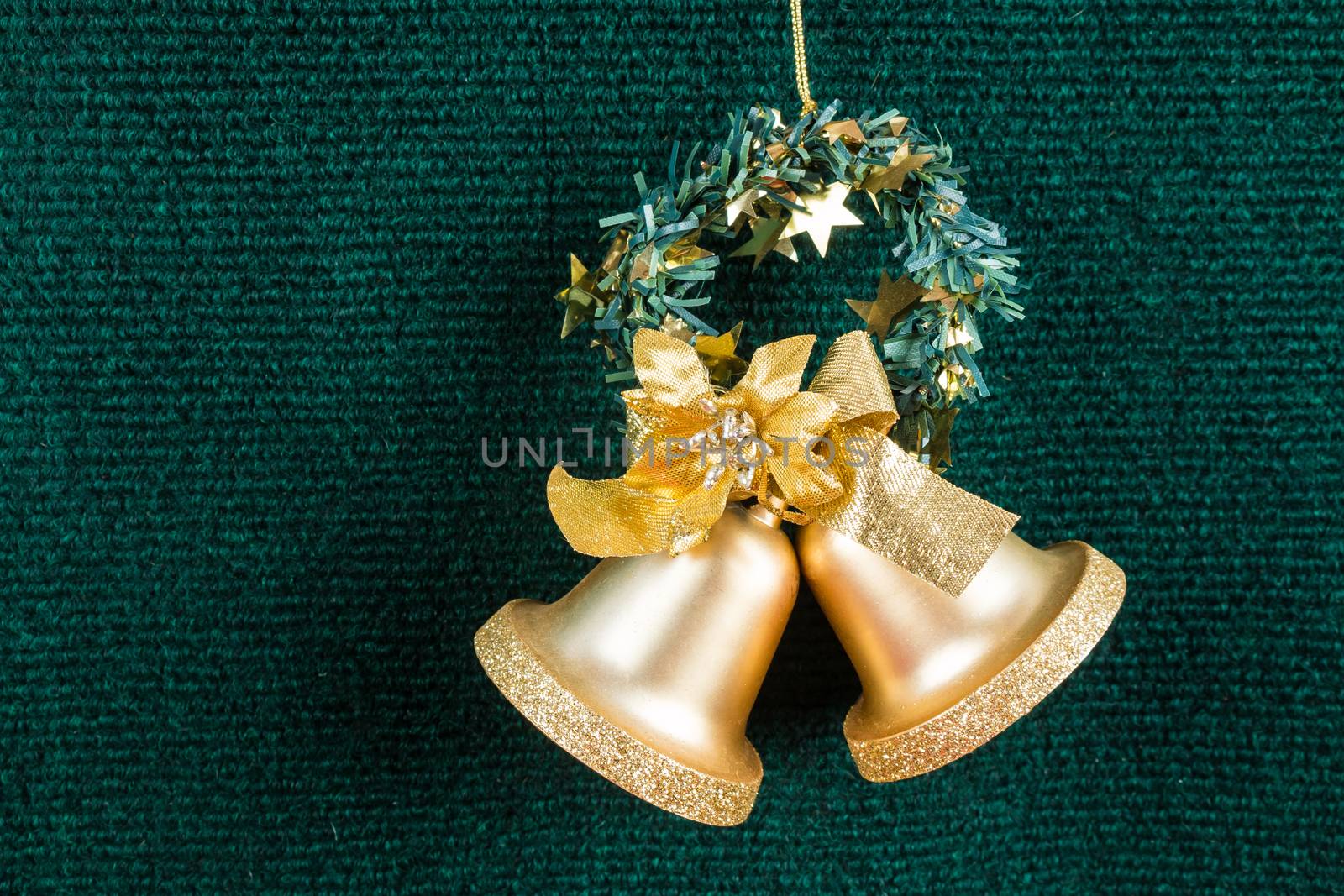 gold bells on green carpet , use for background