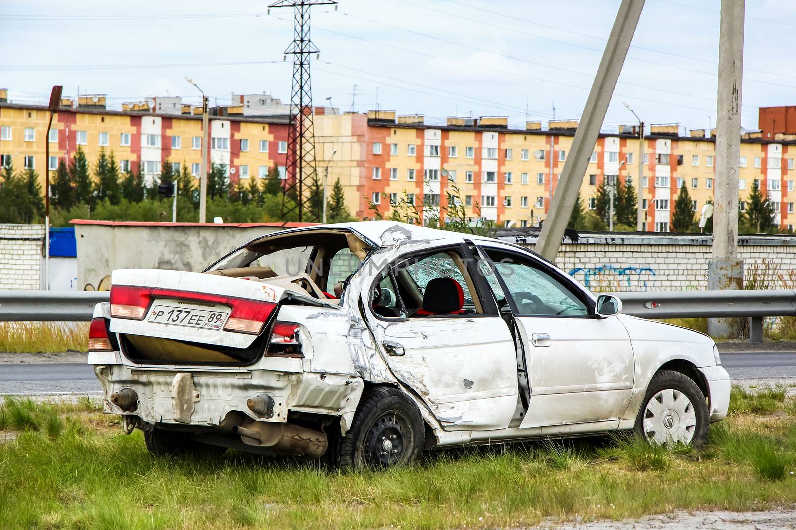 NOVYY URENGOY, RUSSIA - AUGUST 16, 2015: Crashed motor car Nissan Sunny at the city street.