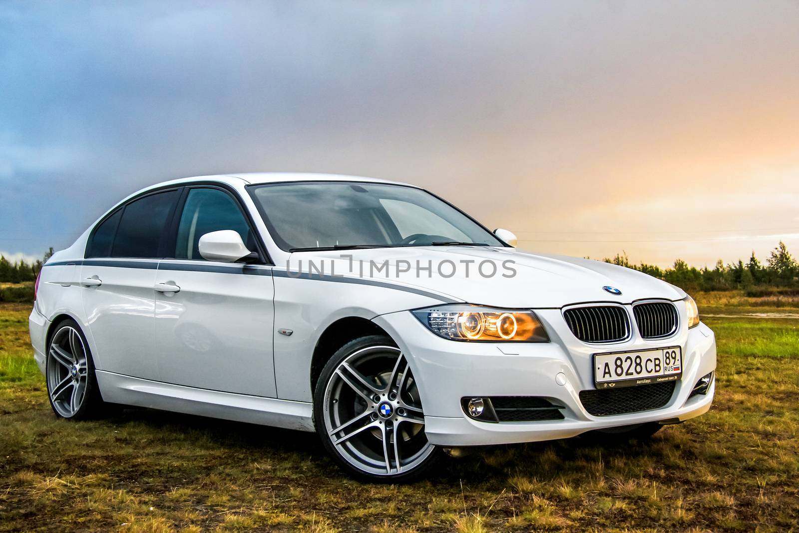 NOVYY URENGOY, RUSSIA - AUGUST 21, 2015: Motor car BMW E90 318i at the countryside.