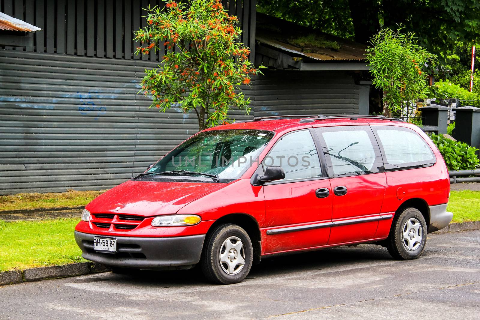 PUCON, CHILE - NOVEMBER 20, 2015: Motor car Chrysler Caravan at the town street.