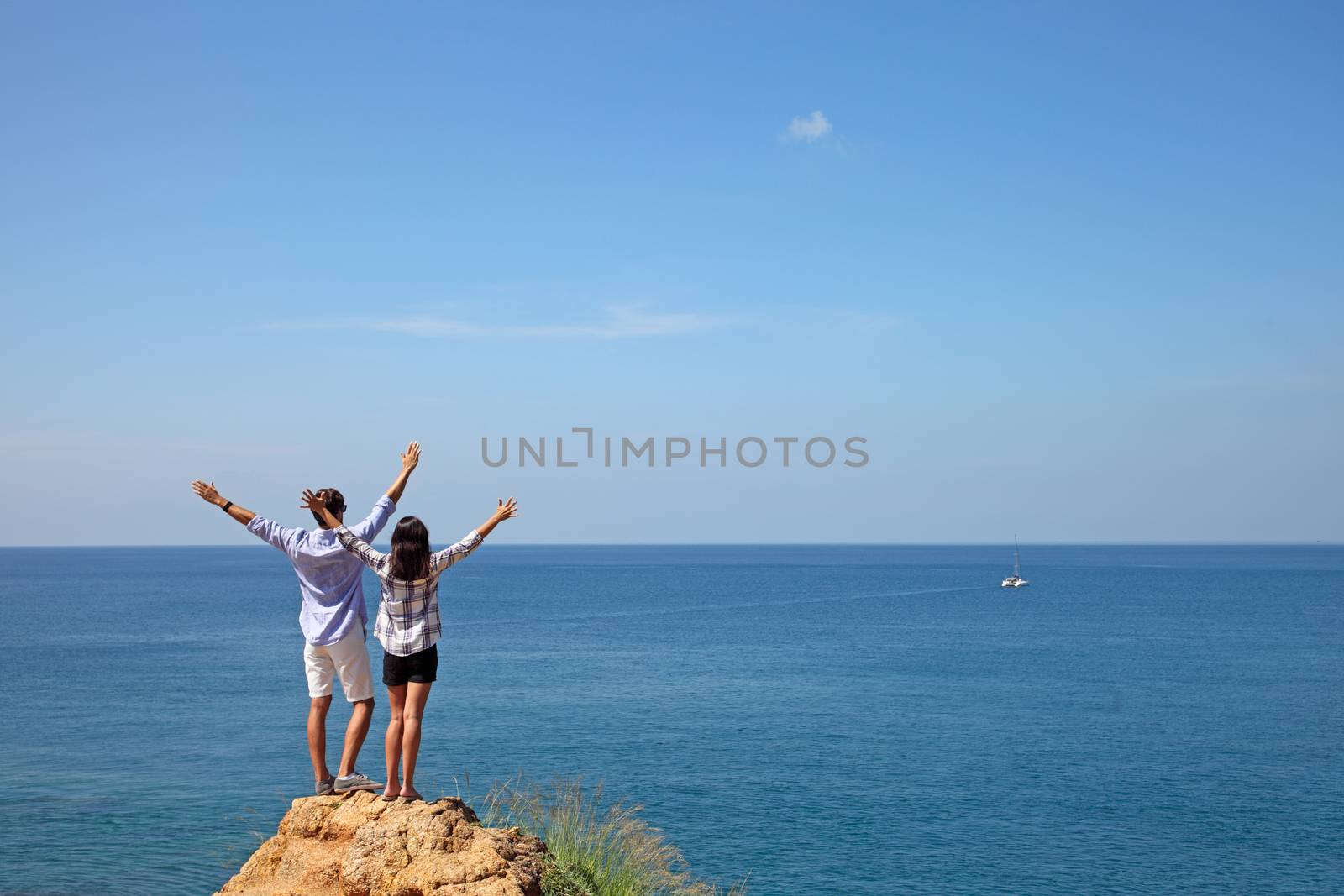 Young couple enjoy beautiful sea view on vacation