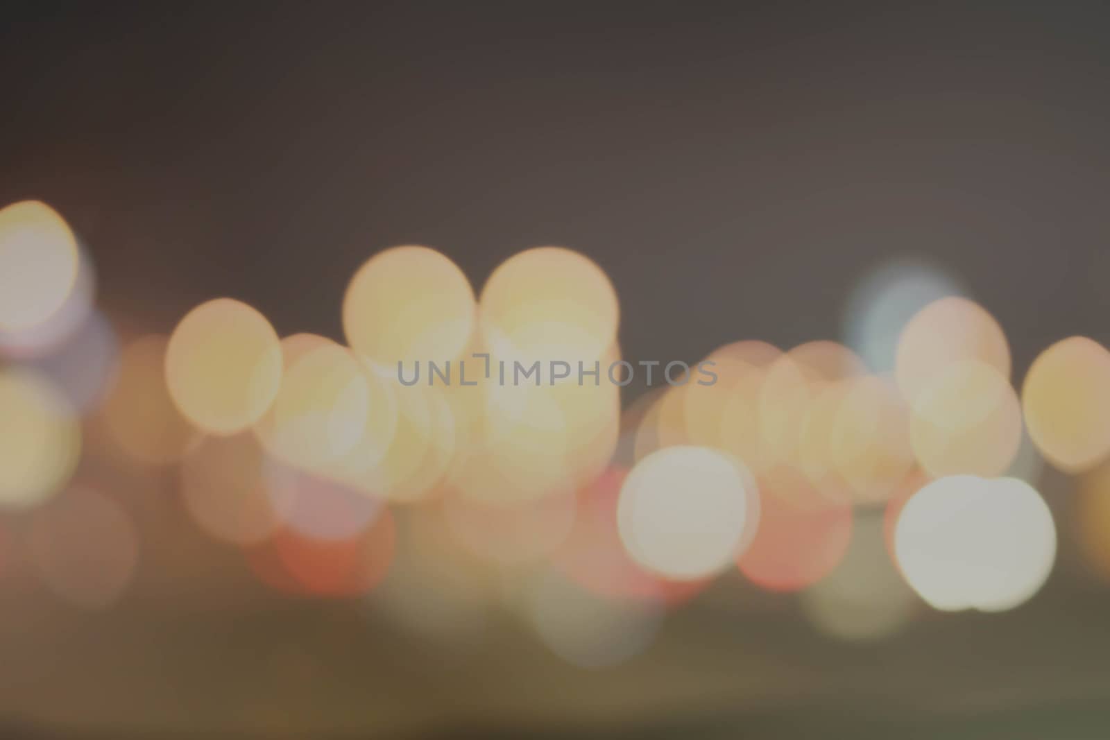 Abstract black and gray bokeh background.