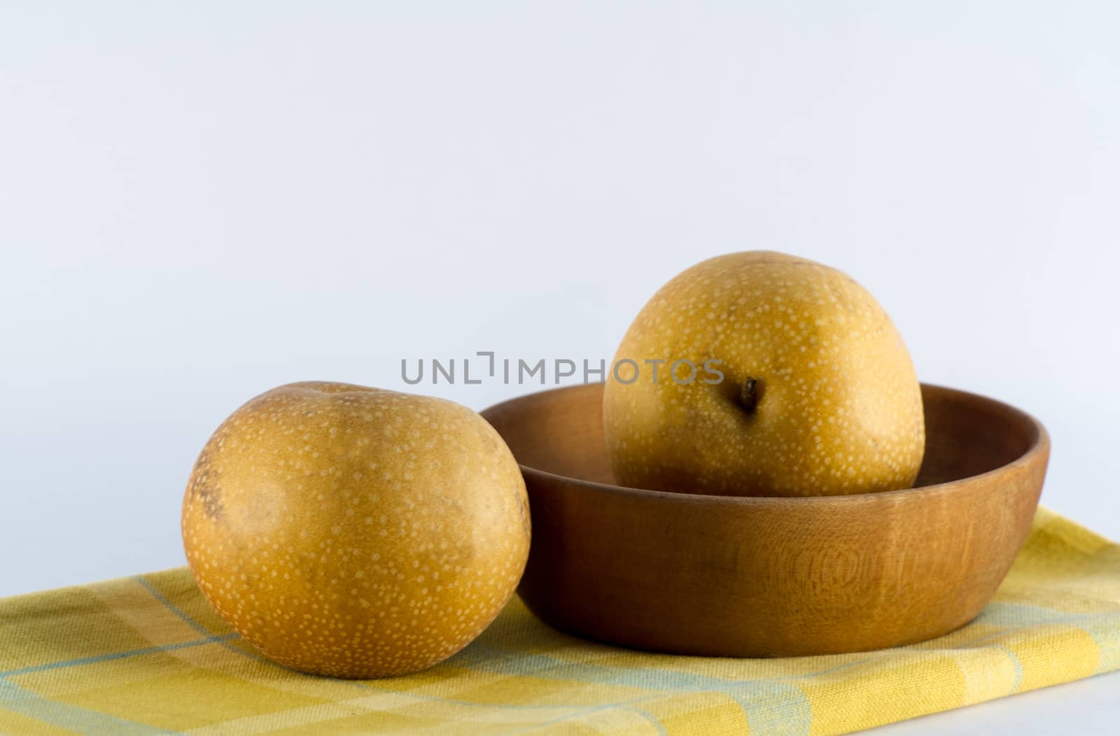 Asian Pears, Wooden Bowl, and Yellow Plaid Napkin by krisblackphotography