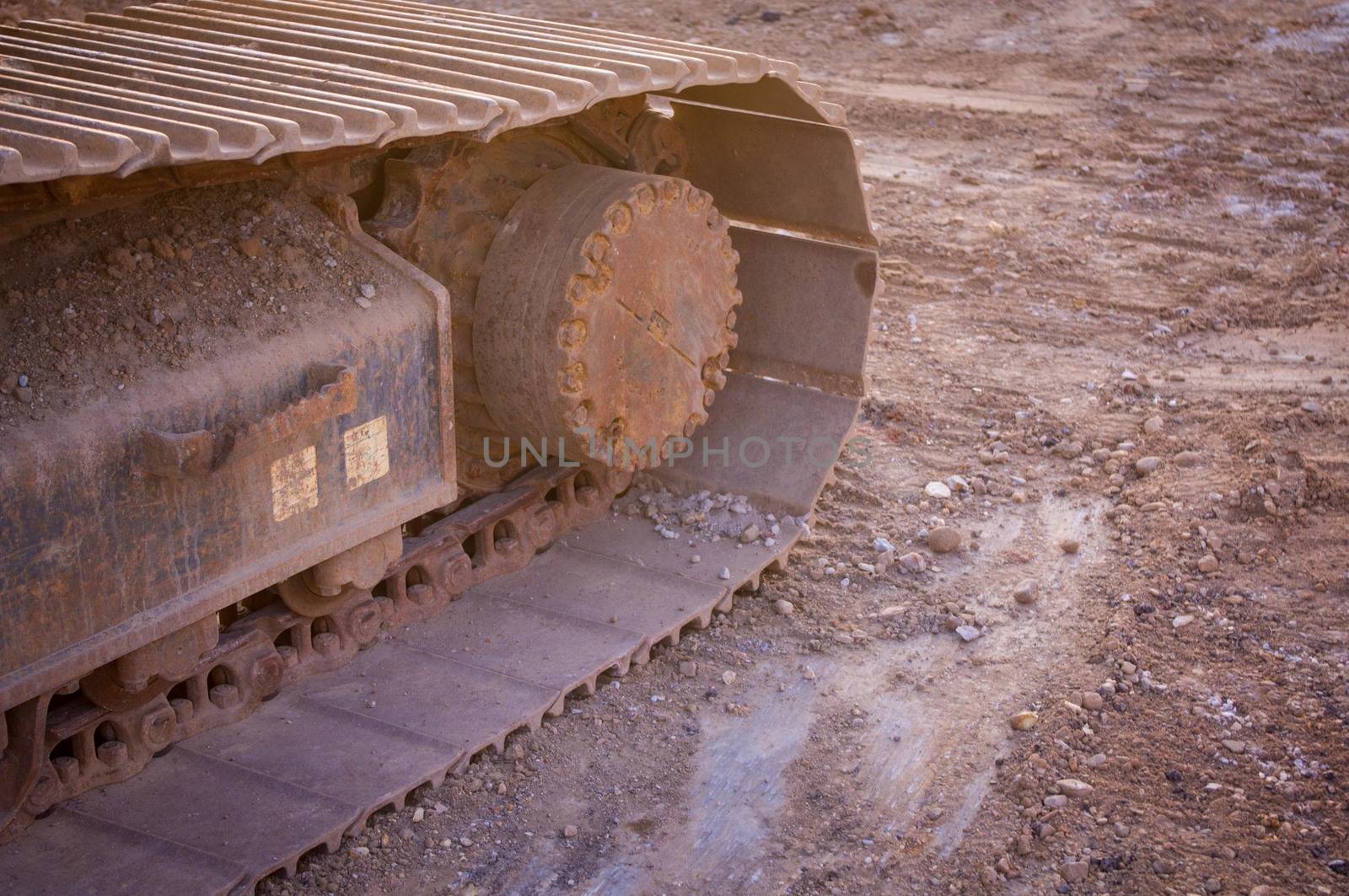 Bulldozer close up with dirt background