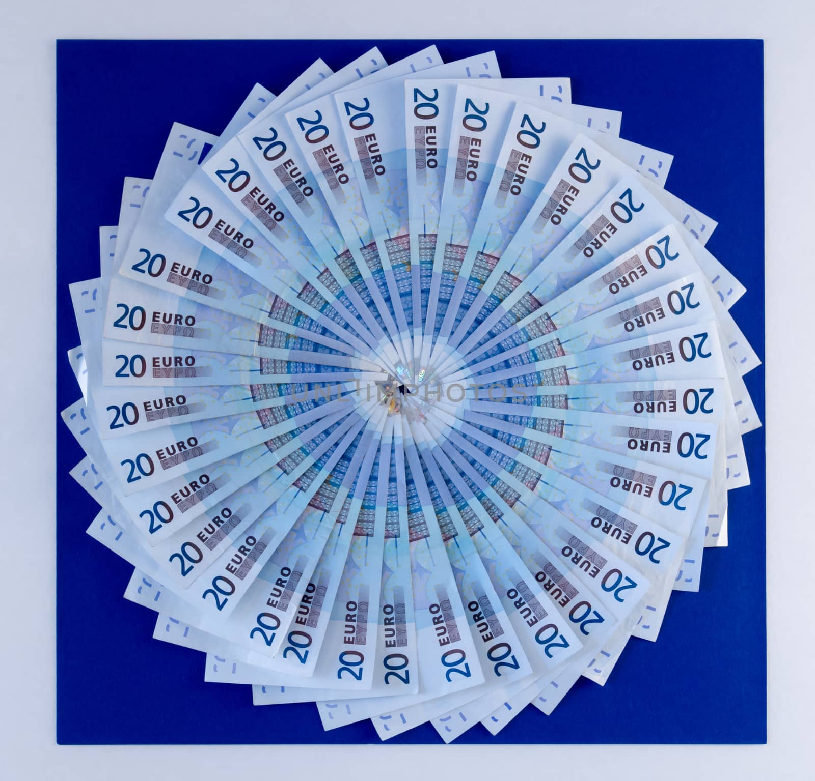Circular Fan of Euros on Vibrant Blue by krisblackphotography