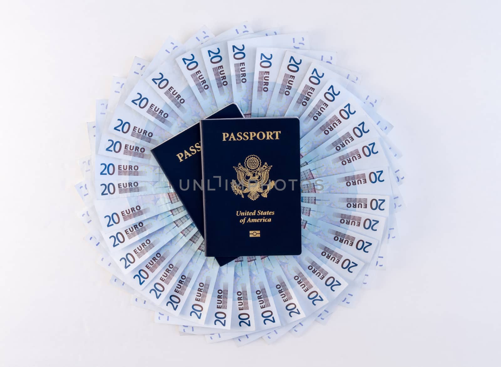Travel scene with circular fan of Euros (20's) and two passports