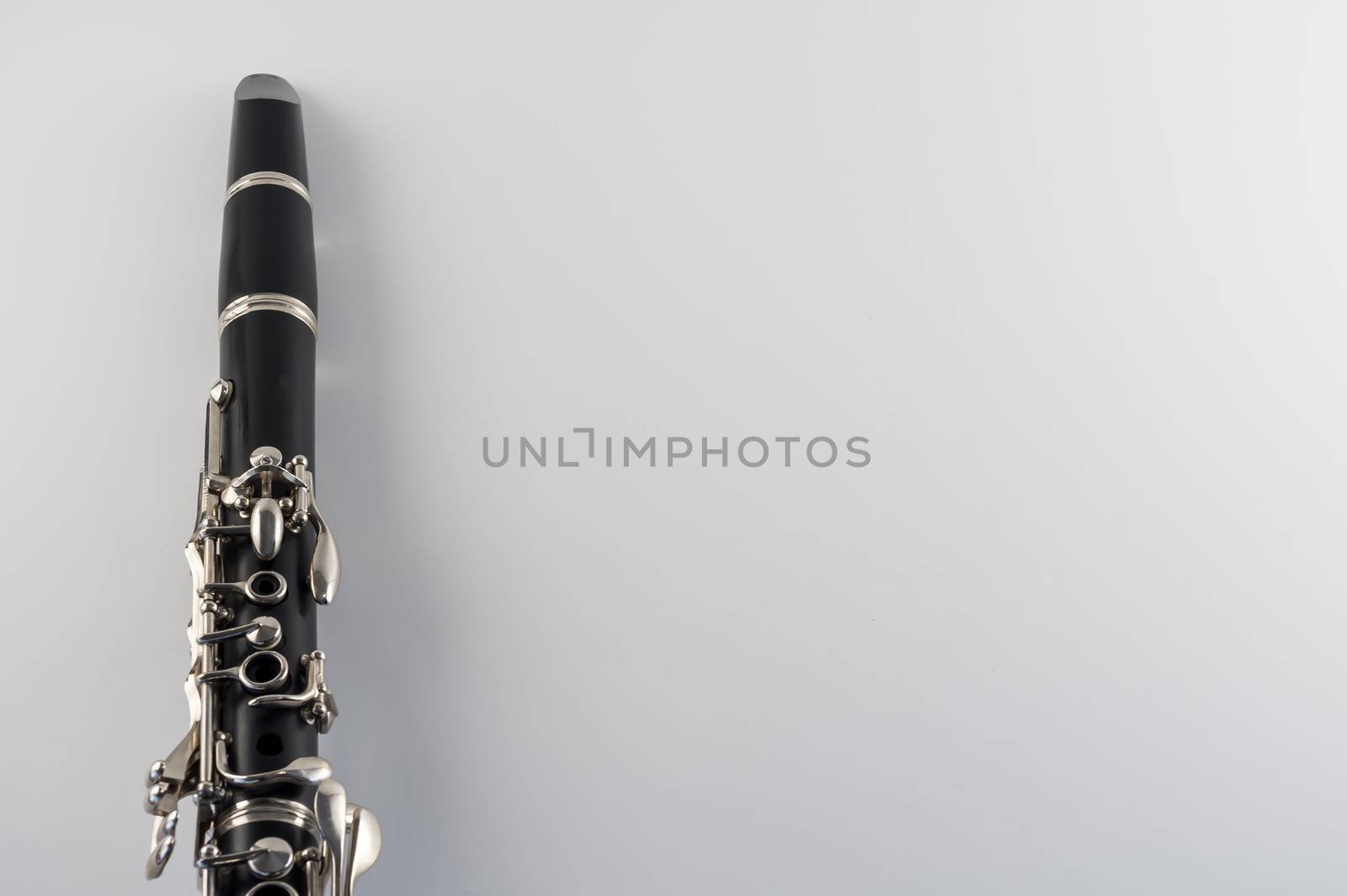 Black clarinet closeup on white background