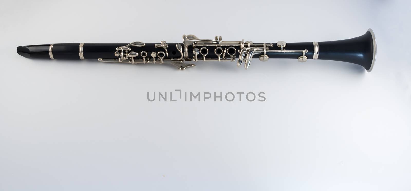 Black clarinet musical instrument on white background