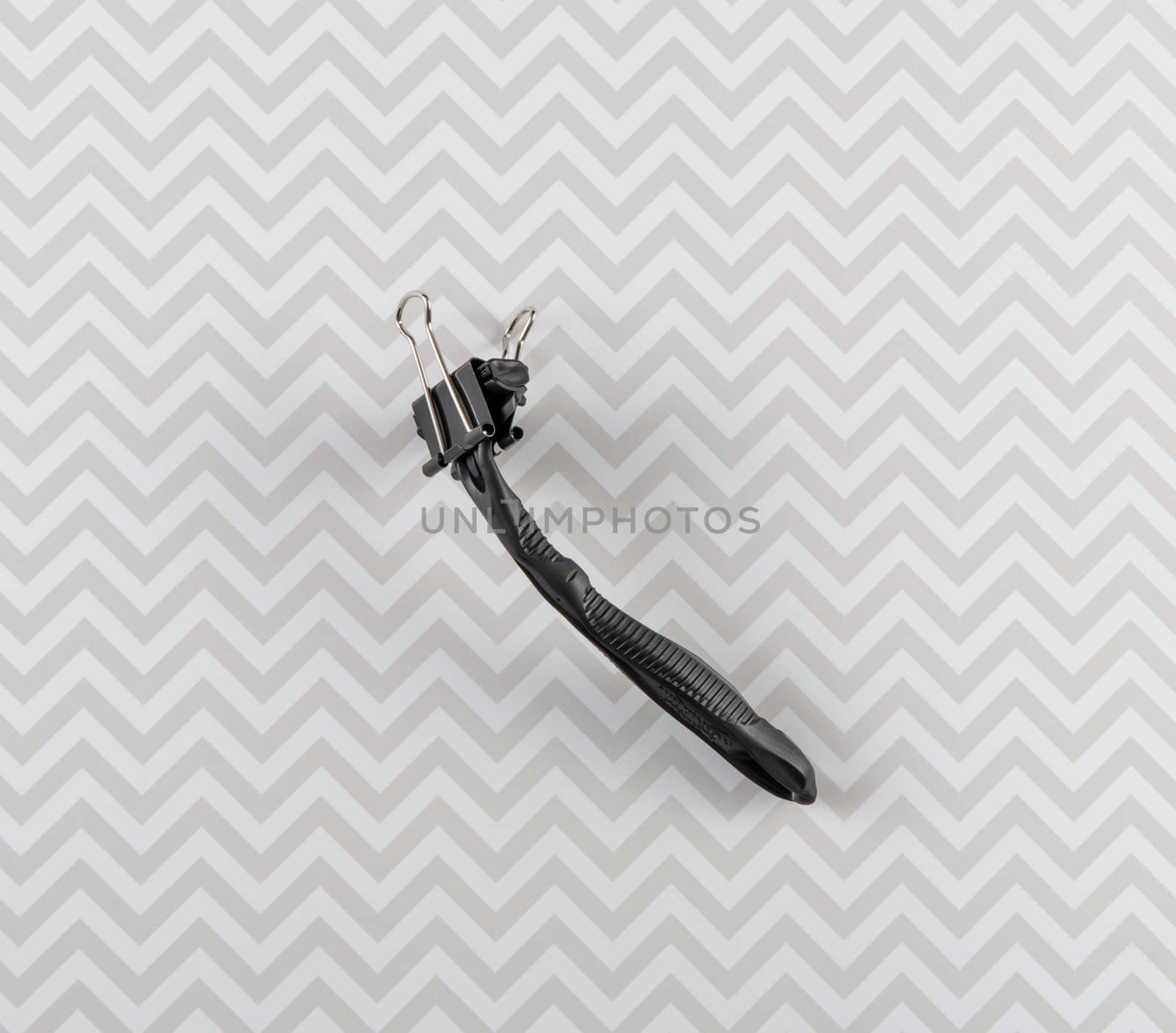 Disposable Razor With Binder Clip Side View by krisblackphotography