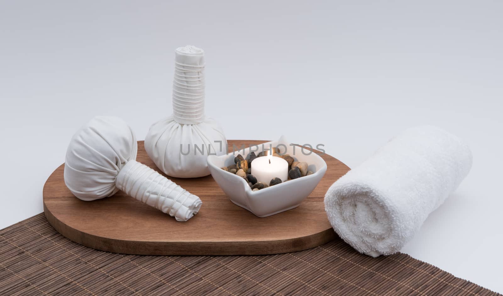Herbal Massage Balls with Candle and Towel by krisblackphotography
