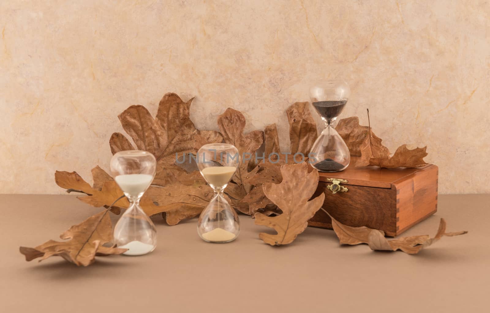 "Time" theme with hourglasses and autumn leaves