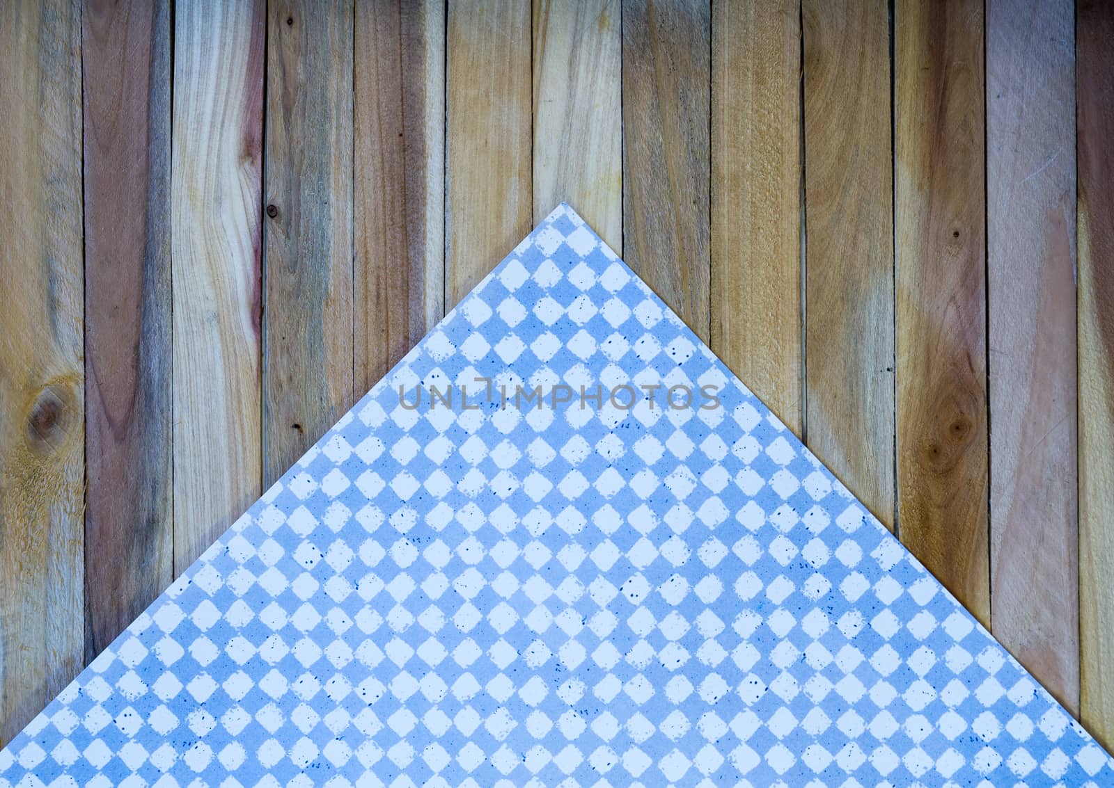Light Blue Check Napkin on Wood Plank Background by krisblackphotography