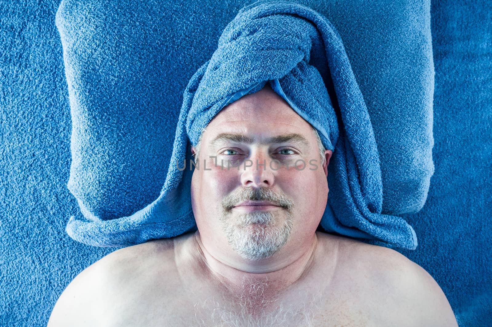 Man in blue turban towel at the spa