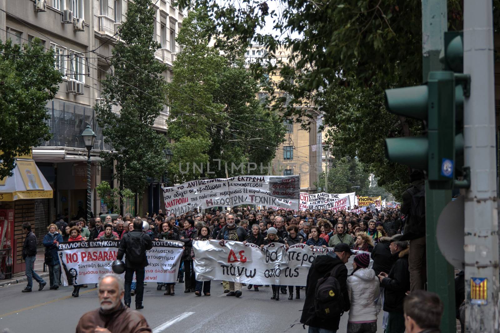 GREECE, Athens: People march down the streets as thousands demonstrate in Greece's capital city to fight against planned cuts in future benefits and increased social security contribution on January 16, 2016.  Saturday's protests in Omonia Square involves civil servants who are members of ADEDY. The unions said they are against plans for employees's social security contributions to be increased by 0.5 percent. 