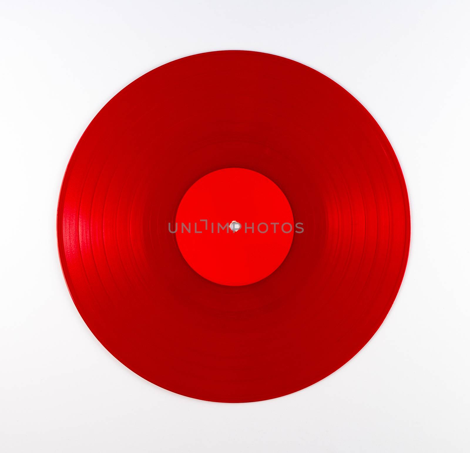 Red vinyl record album on white background