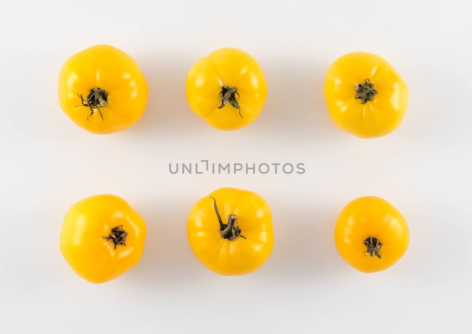 Ripe Yellow Heirloom Tomatoes by krisblackphotography