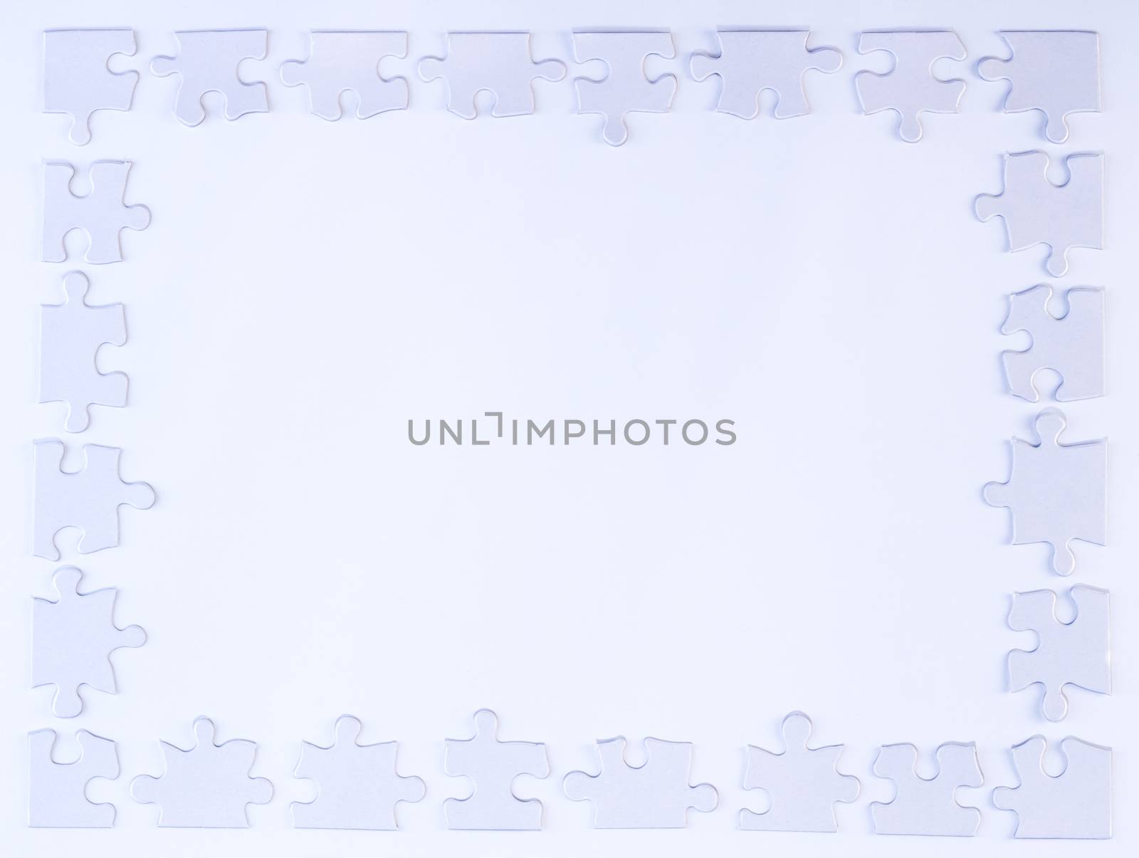 White puzzle piece border on white background