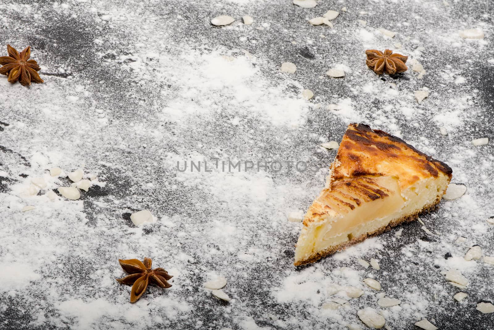 Piece of sweet tasty pear pie on split flour