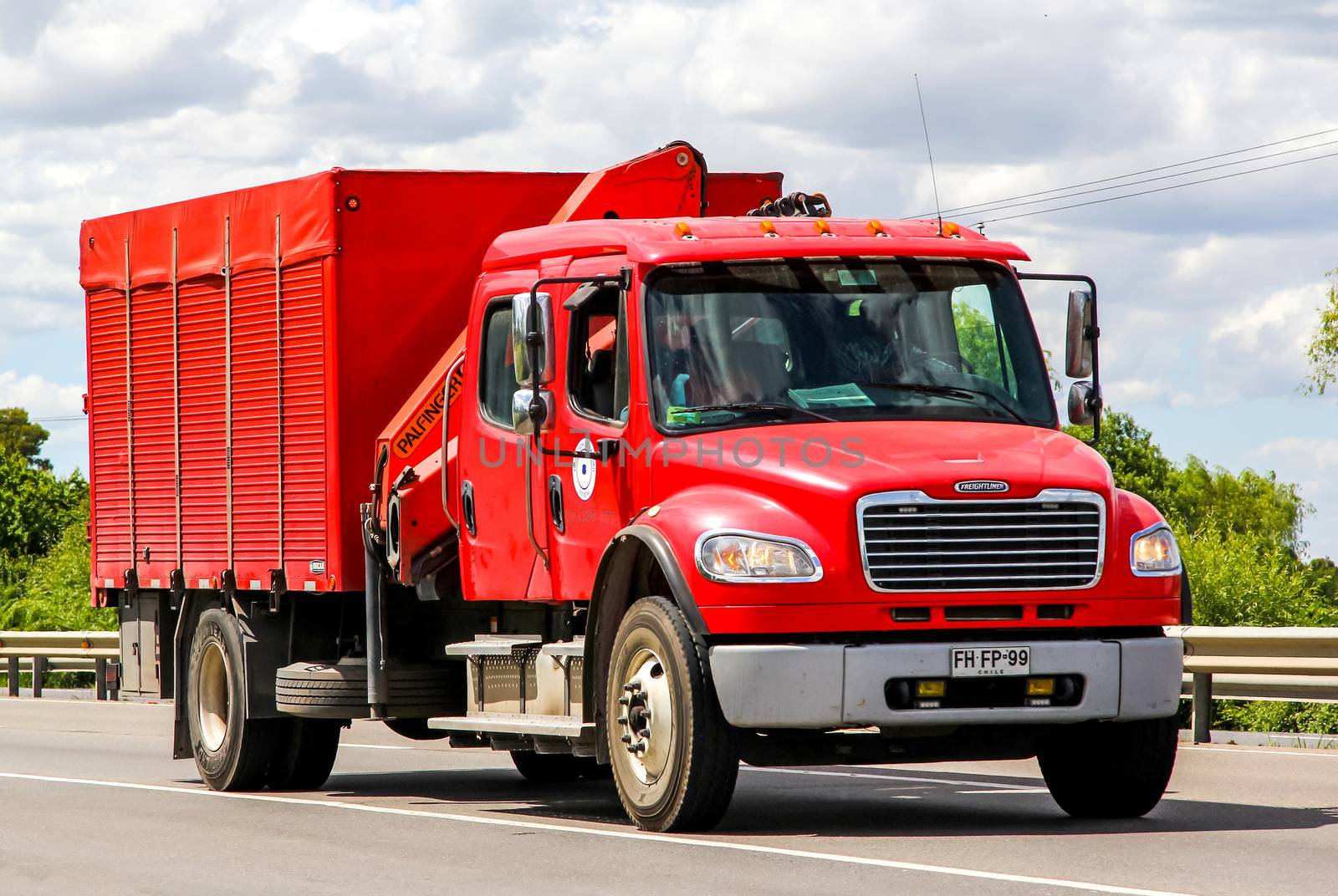 BIO-BIO, CHILE - NOVEMBER 23, 2015: Cargo truck Freightliner Business Class at the interurban freeway.