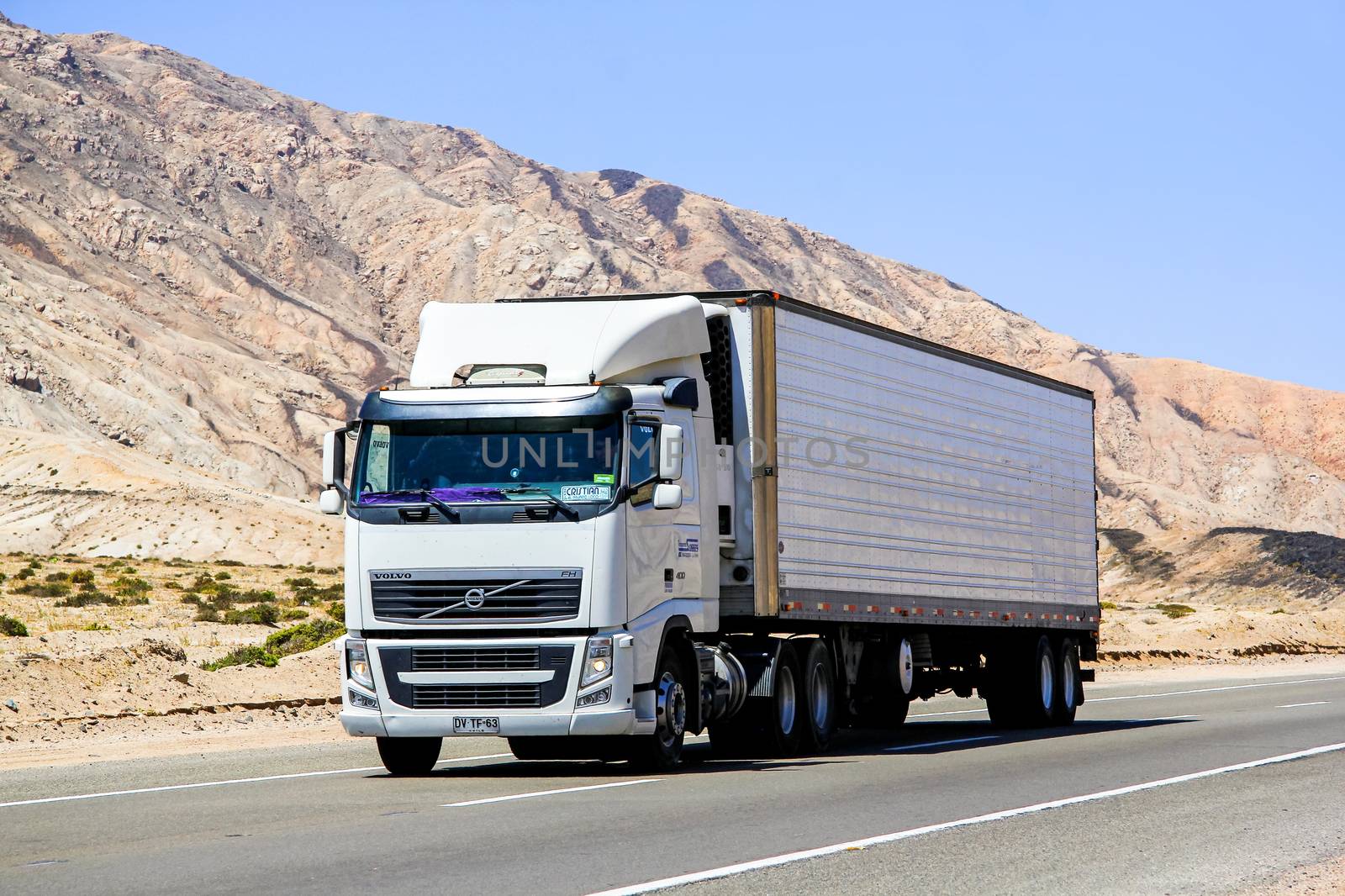 ATACAMA, CHILE - NOVEMBER 14, 2015: Semi-trailer truck Volvo FH12 at the interurban freeway through the Atacama desert.