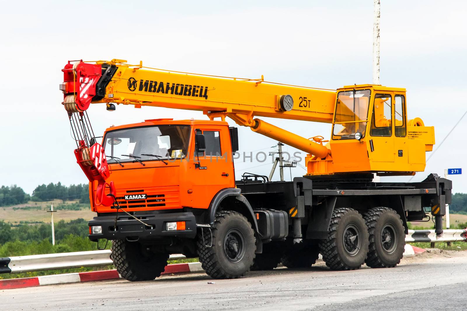 CHELYABINSK REGION, RUSSIA - JULY 21, 2012: Off-road mobile crane Kamaz 43118 at the interurban road.