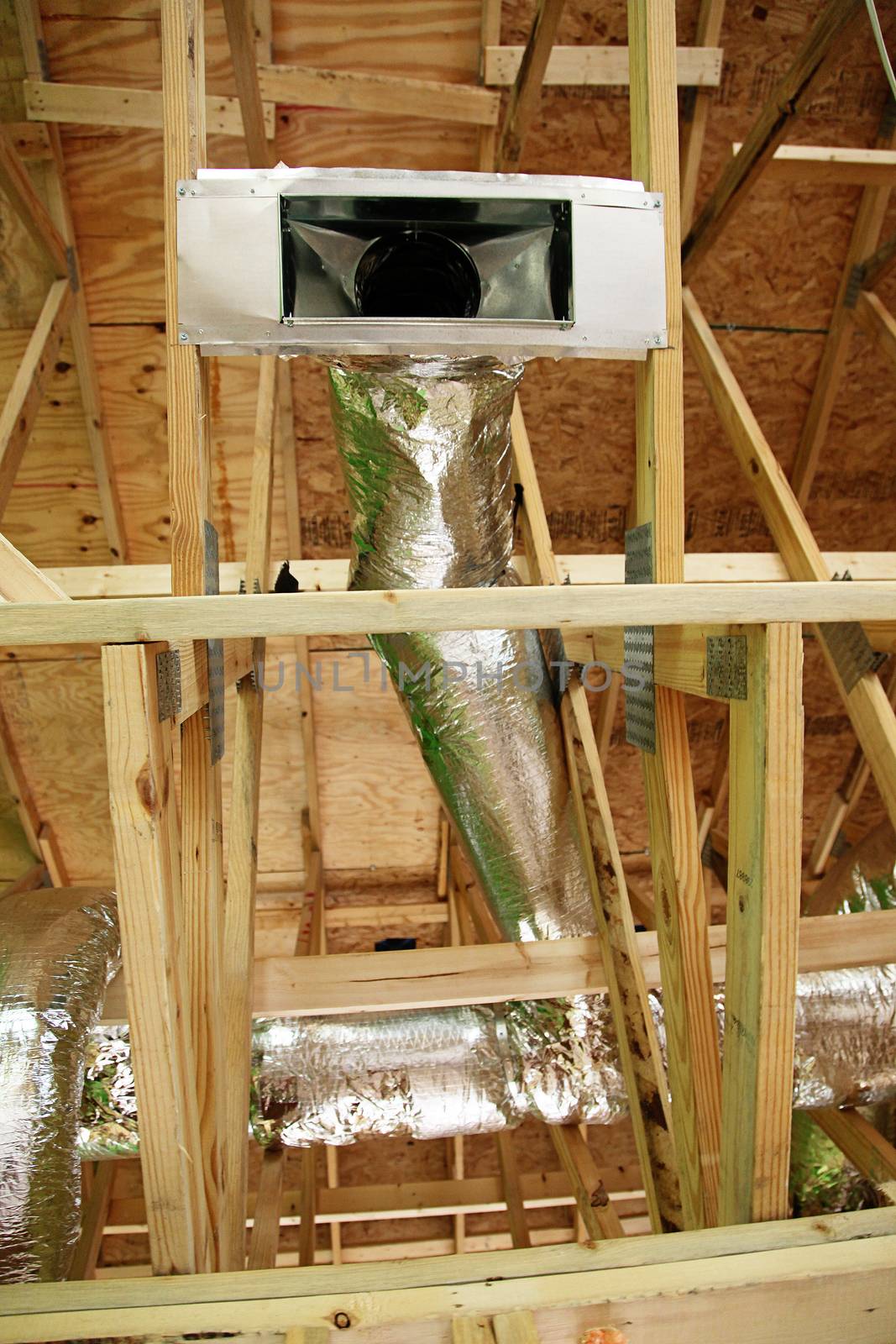 Open AC Heating Vent and Tubing in Ceiling of New Home Construction.